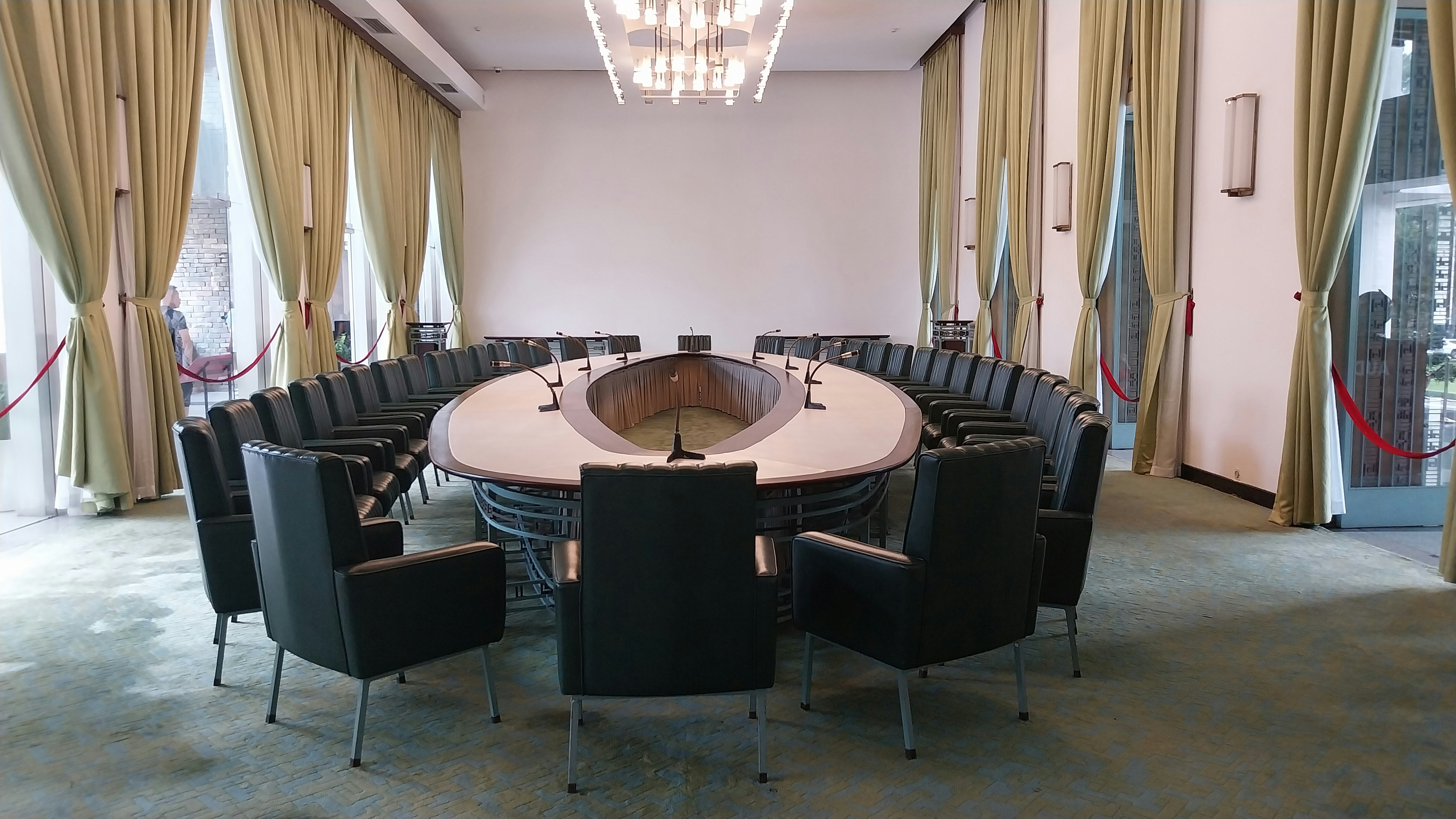 Stakeholders discussing new AI governance frameworks. | Photo by Edwin Petrus on Unsplash