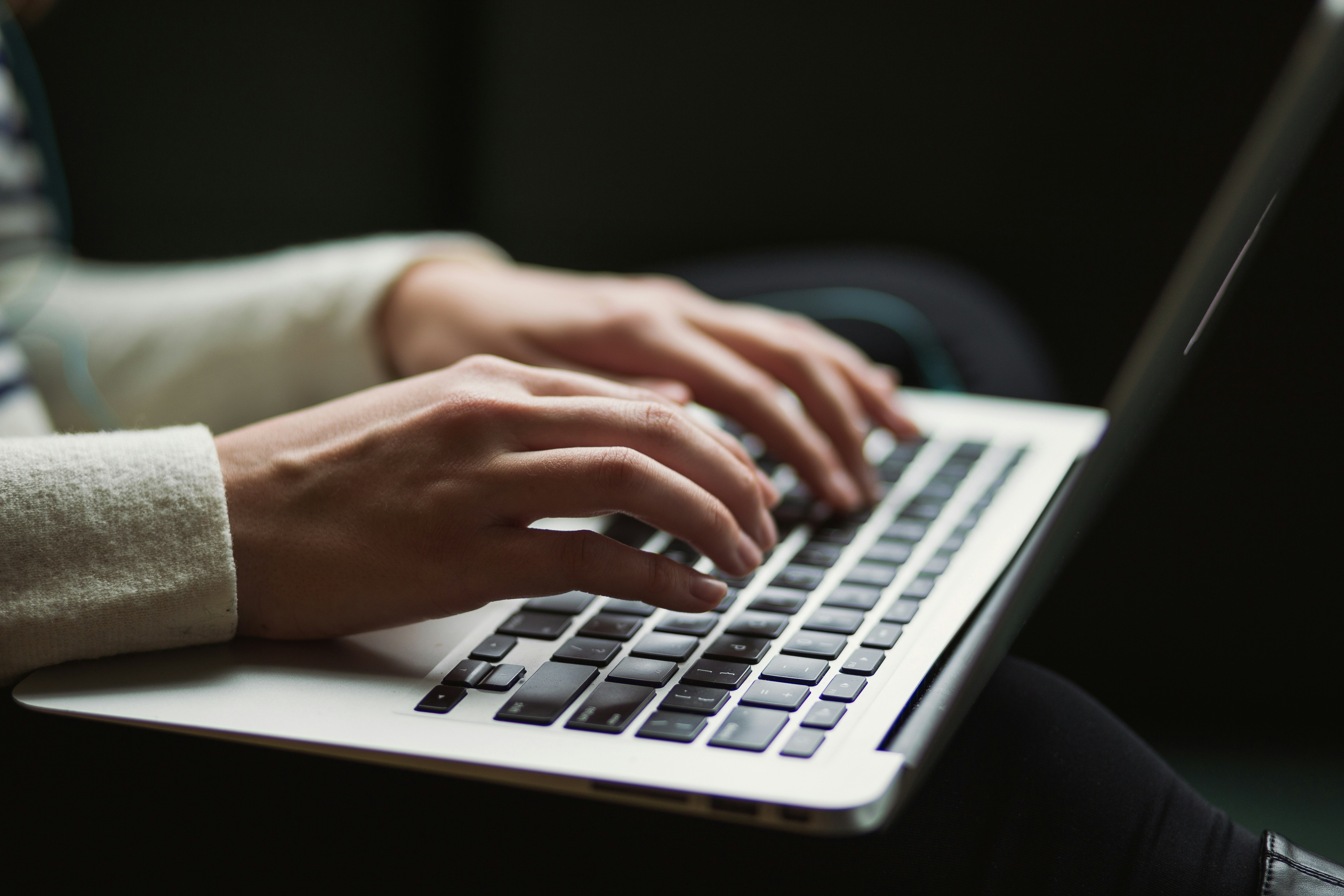 A user interacting with an AI-powered web application. | Photo by Kaitlyn Baker on Unsplash