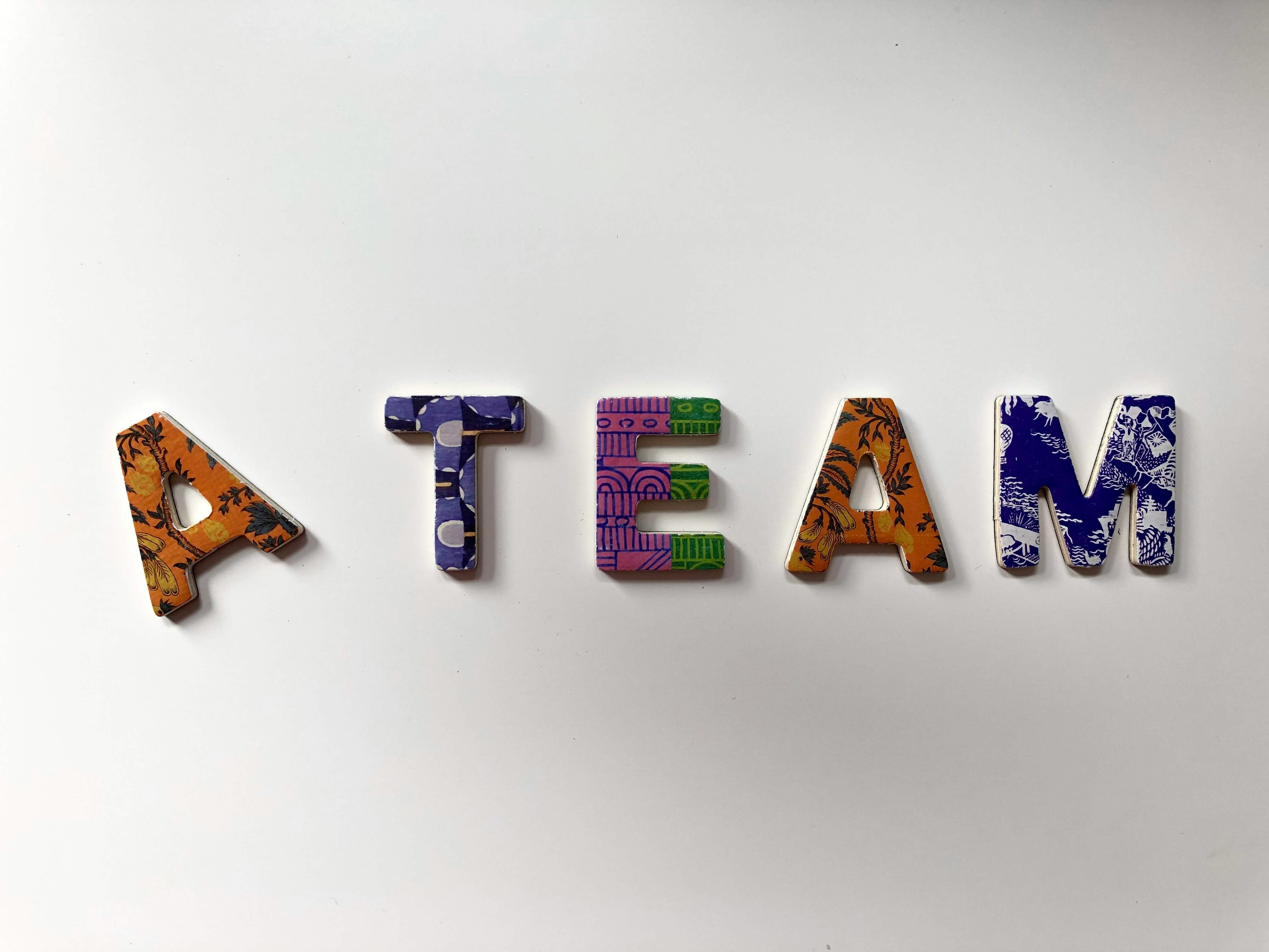Small teams developing AI software with new benchmarking tools. | Photo by Merakist on Unsplash